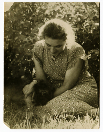 Ussr - CIRCA 1970s: An antique Black & White photo show young woman in the gardenのeditorial素材