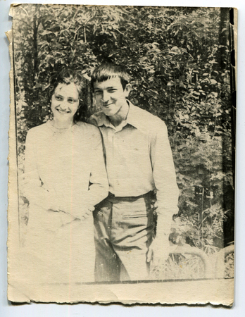 Ussr - CIRCA 1970s: An antique Black & White photo show Boy and girl in the gardenのeditorial素材