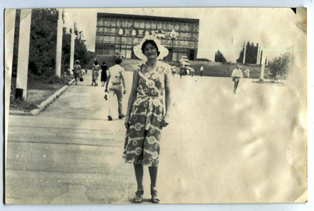 Ussr - CIRCA 1970s: An antique Black & White photo show young woman on a street in the city of Petropavlovskのeditorial素材