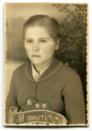 USSR - CIRCA 1960s: studio Portrait of a beautiful young woman, inscription on the photo "in memory", circa 1960sのeditorial素材