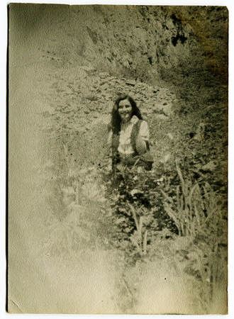 Ussr - CIRCA 1970s: An antique Black & White photo show beautiful girl outdoors in the gardenのeditorial素材
