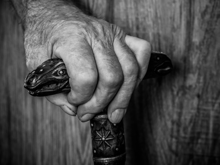 old hands with a caneの写真素材