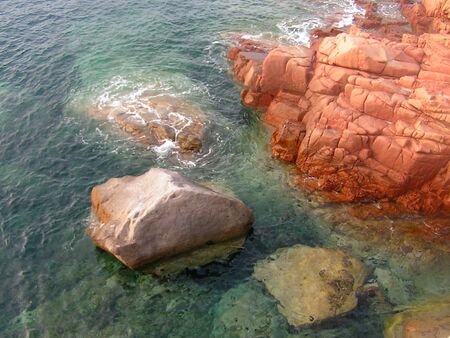 red rocks in sea of sardiniaの写真素材