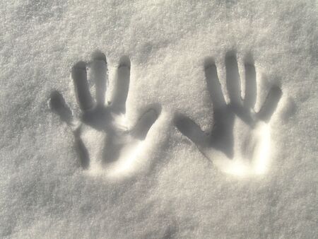 a nice view of hands in the snowの写真素材