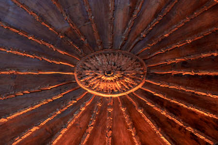 Old wood carving. Brown color. Arrows in the middle of the frame grows.の写真素材