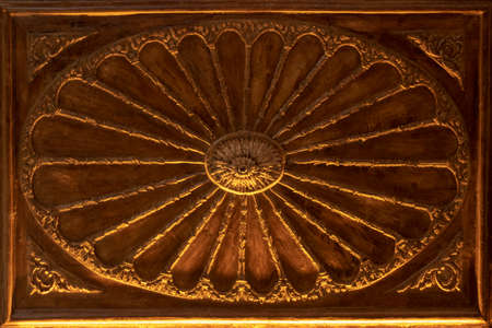 Old wood carving. Brown color. Arrows in the middle of the frame grows.の写真素材