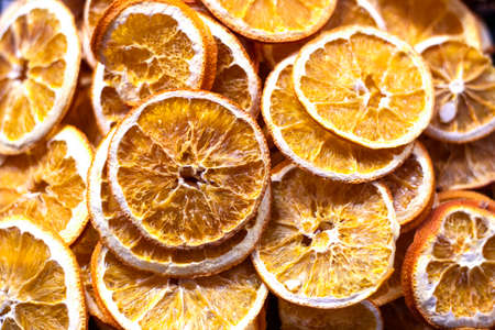 Slices of dried lemon. The picture was taken on the bench. It has sour taste.の写真素材