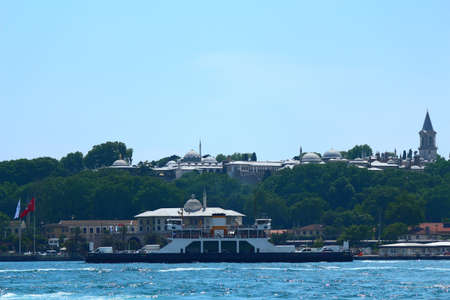 The view of the Ottoman period topkapi palace from the sea. Steamboat on the sea. Sunny sky.の写真素材
