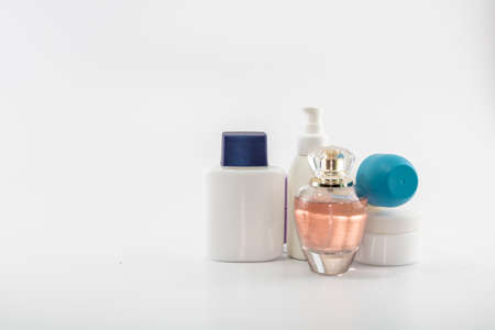Set consisting of sun cream, parfum, nail polish, lotion. isolated. shot white background.の写真素材