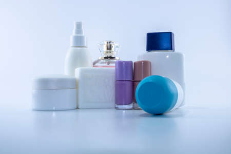 Set consisting of sun cream, parfum, nail polish, lotion. isolated. shot white background.の写真素材
