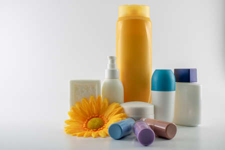 Set consisting of sun cream, parfum, nail polish, lotion. isolated. shot white background.の写真素材