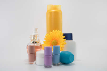 Care set consisting of shampoo, poarfum, lotion, soap, nail polish, sun cream. Isolated on white backgroundの写真素材