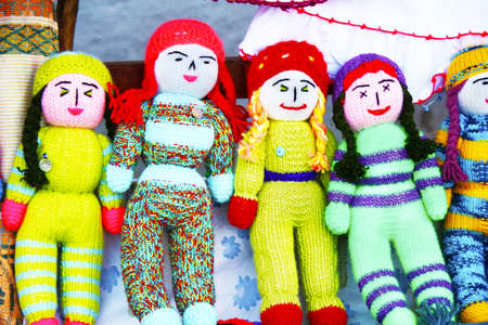 Colorful knitted babies. on the benchの写真素材