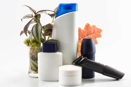 Shaver, soap, shampoo, deodorant, cream set. Flowers and isolated background.の写真素材