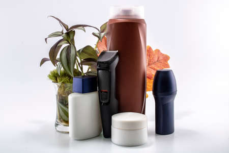 Shaver, soap, shampoo, deodorant, cream set. Flowers and isolated background.の写真素材