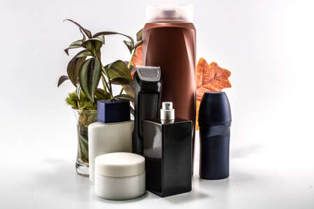 Shaver, soap, shampoo, deodorant, cream set. Flowers and isolated background.の写真素材