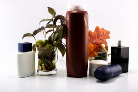 Cosmetic kit. Male care. Personal care. White and flowers background.の写真素材