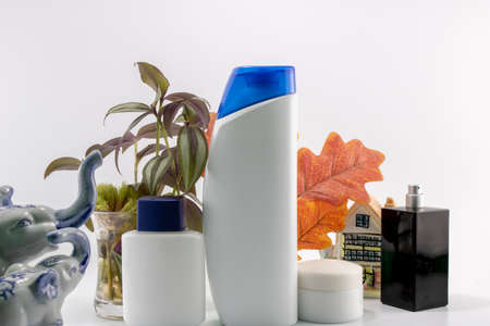 Cosmetic kit. Male care. Personal care. White and flowers background.の写真素材