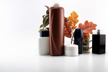 Cosmetic kit. Male care. Personal care. White and flowers background.の写真素材