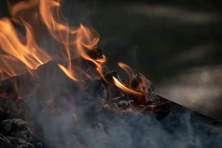 Close up of flaming wood embersの写真素材