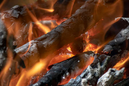 Close up of flaming wood embersの写真素材