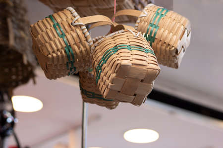 Decorative knitted baskets. Hanging from above. The photo was taken in front of the store.の写真素材