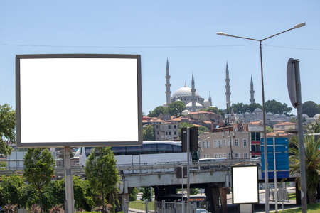 There is an advertising sign next to the pavement in the park.の写真素材
