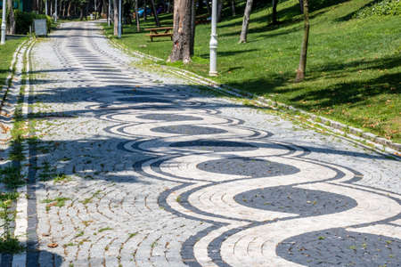 Walk in Mill Par. Basalt stones decorative way with cubic stones. Trash bin and picnic table.の写真素材