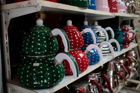 Enamel teapot variegated close-up. Photographed in front of the store.の写真素材
