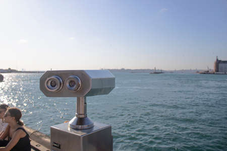 Istanbul, Turkey - September-14,2019: Binoculars on the edge of the Bosphorus. To get closer to the view. Working with coins. It was taken on the beach.の写真素材