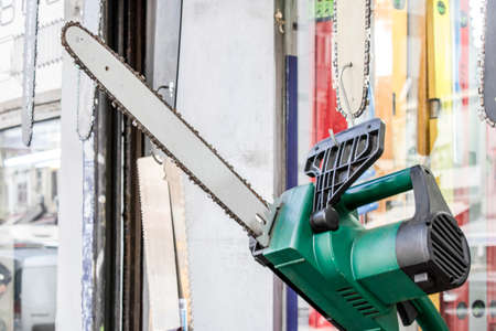 Unused chainsaw in front of the store.For sale.の写真素材
