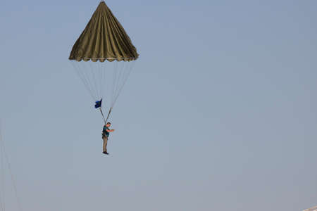 Istanbul, Turkey - September-18,2019: He is training people with a parachute attached to a crane.の写真素材