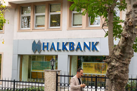Istanbul, Turkey - November-10.2019: Halkbank is a state-owned bank. Photo of the exterior view of the minister located in Levent. Between the trees.のeditorial素材