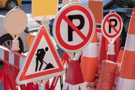 The photo was taken in front of the store selling warning signs used in traffic. Signs in red and...