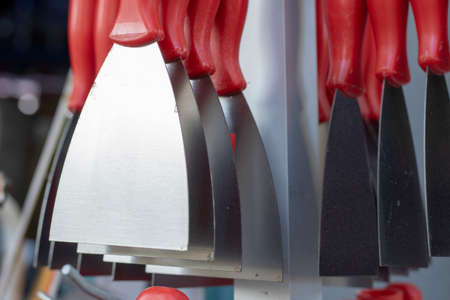 Multiple spatulas hanging on the counter. New unused. The photoの写真素材