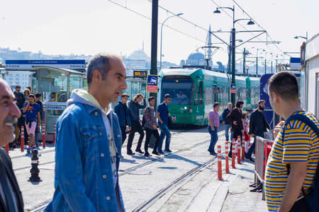 Photo of Karakoy tram stop. People walking around and waiting for tram.のeditorial素材