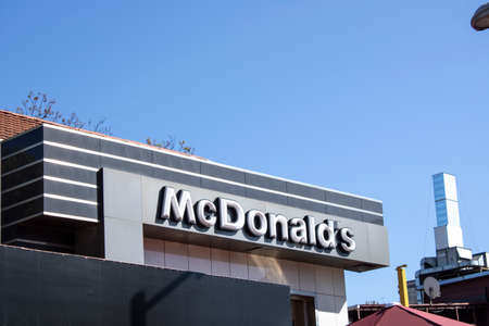 McDonalds restaurant sign. The McDonalds Corporation is the worlds largest chain of hamburger fast food restaurants.のeditorial素材