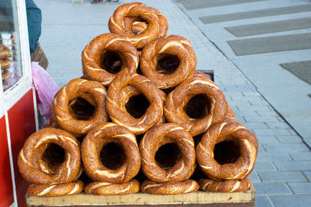 Bagel counter close-up. The bagels on it are arranged in a triangle. ,Turkish bagel,