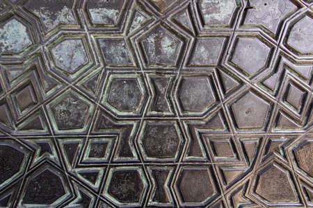 The quadrilateral patterns on the historical door of the Ottoman period close up.