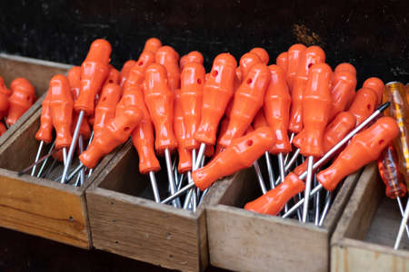 Screwdrivers at checkout in front of the store. Our red handle is stalked. It is unused and new. Close up.の写真素材