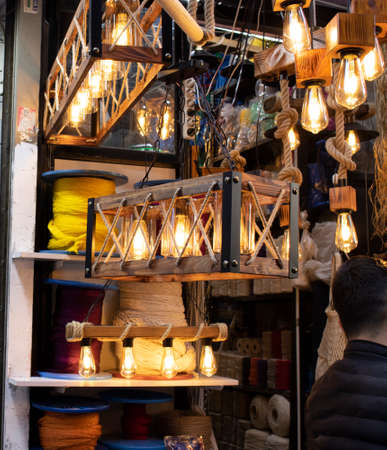 The lamps attached to the yellow rope are used as decor. These decorative lamps look old in stores and cafes.の写真素材