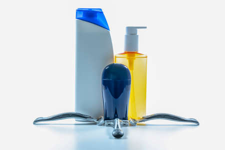 Shampoo bottles and razor blade close-up for male. A photo was taken in the studio. White background.の写真素材