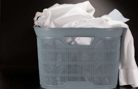 Linen prepared for washing in a basket with washing means .の写真素材