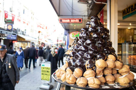 Istanbul, Turkey - November-02.2019: Balls with a non-chocolate cake inside. Melted chocolate was...