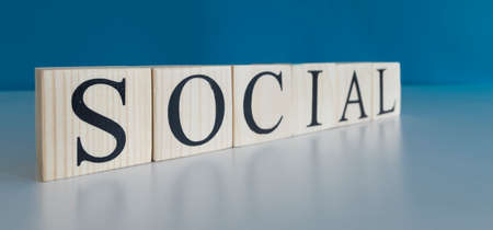 Social text on wooden cubes. Close-up and blurred background.の写真素材