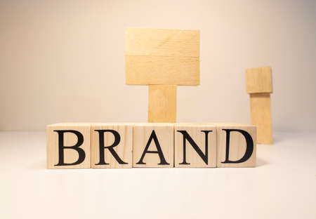 Make your own brand. Brand word with wooden letter cubes.の写真素材