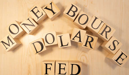 Istanbul, Turkey -May- 10.2020: Fed, Bourse, Money and dollar texts from wooden cubes. Photographs were taken on the wooden table.のeditorial素材