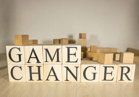 Game changer text on wooden cube blocks. Close up. Consept.の写真素材