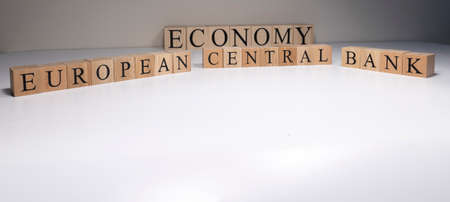 European central bank text from wooden cubes. With spot light in the studio and white background.の写真素材