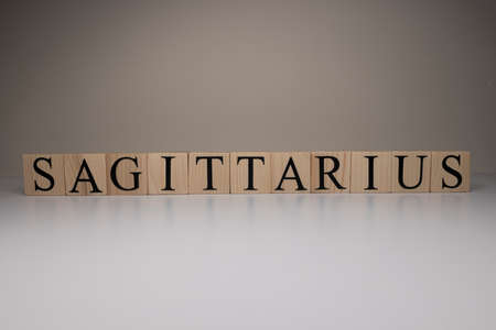 Sagittarius word on wooden cubes on white background. Photographed in the studio and in spot light....